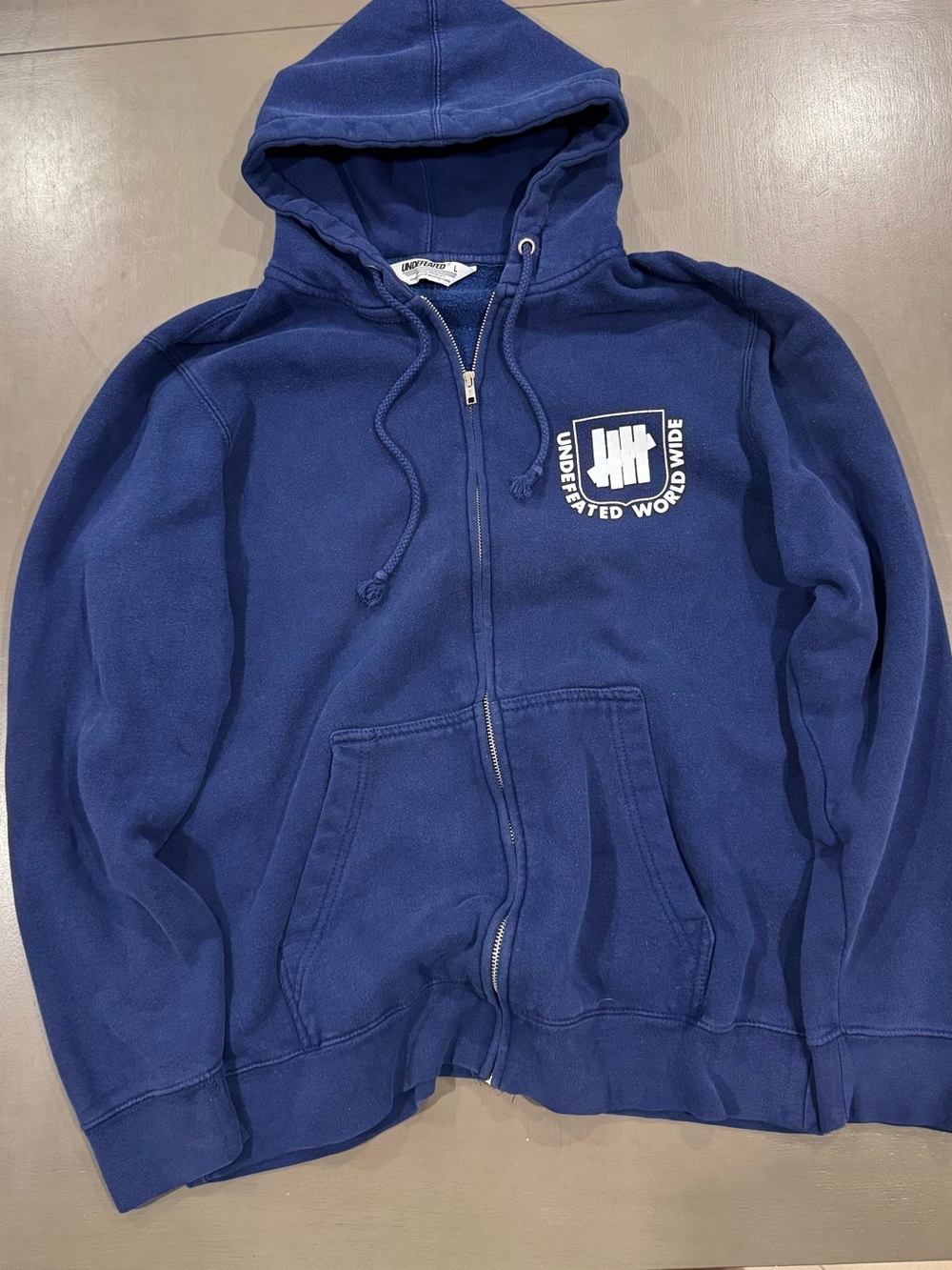 Undefeated Navy Blue Zip-Up Hoodie with Logo